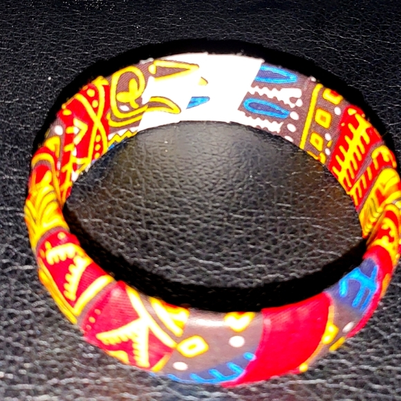 Source Unknown Accessories - NEVER been worn. Multi-Colored Fabric African bracelet.